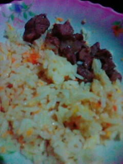 A picture of Carrot Rice with beef.