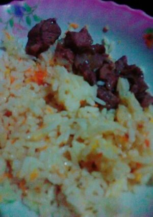 A picture of Carrot Rice with beef.