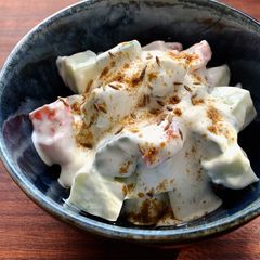 A picture of Cucumber & Tomato Yoghurt Salad with Cumin.