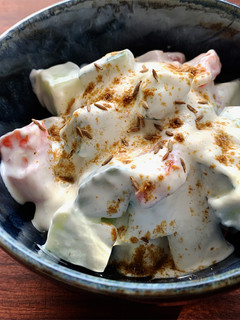 A picture of Cucumber & Tomato Yoghurt Salad with Cumin.