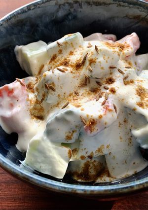 A picture of Cucumber & Tomato Yoghurt Salad with Cumin.