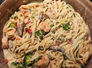 A picture of chicken alfredo with shrimp