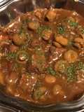 Braised Pork Cheeks with White Mushrooms, Black Tomatoes, and Shallots