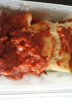 A picture of Boiled yam with tomato sauce.