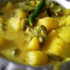 A picture of Jhinge aaloo posto(ridged gourd potato poppy seed curry).