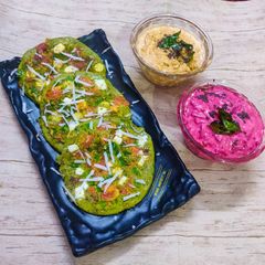 A picture of Spinach Oats Uttapam with Coconut chutney and Beetroot Dip.