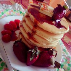 A picture of Greek pan cake with honey.