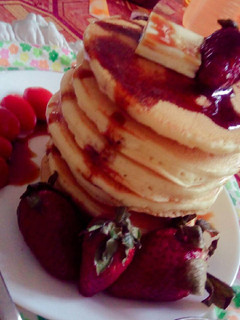 A picture of Greek pan cake with honey.