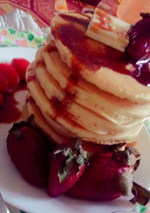 A picture of Greek pan cake with honey.