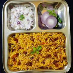 A picture of Black chickpea pulao in pressure cooker.