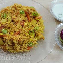 A picture of Tawa pulao with curd.