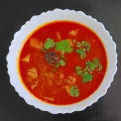 A picture of Restaurant style kathiyavadi Onion and potato vegetable (sak) & Paratha.