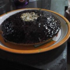 A picture of Marble cake with chocolate topping.