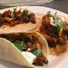 A picture of Spicy shrimp and sausage tacos.