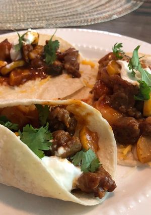 A picture of Spicy shrimp and sausage tacos.