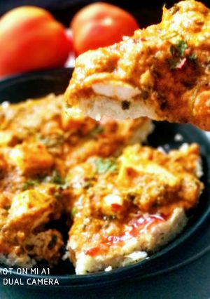 A picture of Fusion of Italian pizza and Punjabi butter panner.
