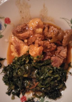 A picture of Stewed beef with greens.