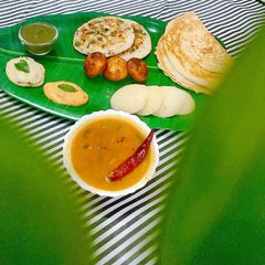 A picture of South Indian Thali - Dosa, Idli, Appam, Uttpam, Sambhar, Chutney.
