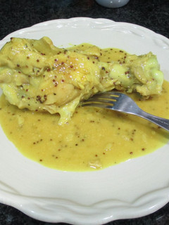 Una foto de Alas de pavo en salsa curry a las dos mostazas