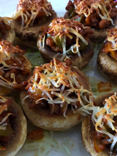 Una foto de Champiñones rellenos de carne al horno