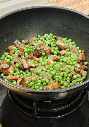 Una foto de Guisantes con Guanciale y Cous-Cous