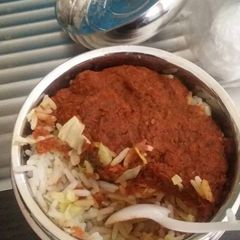 A picture of Rice and stew with cabbage.