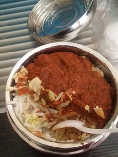 A picture of Rice and stew with cabbage.
