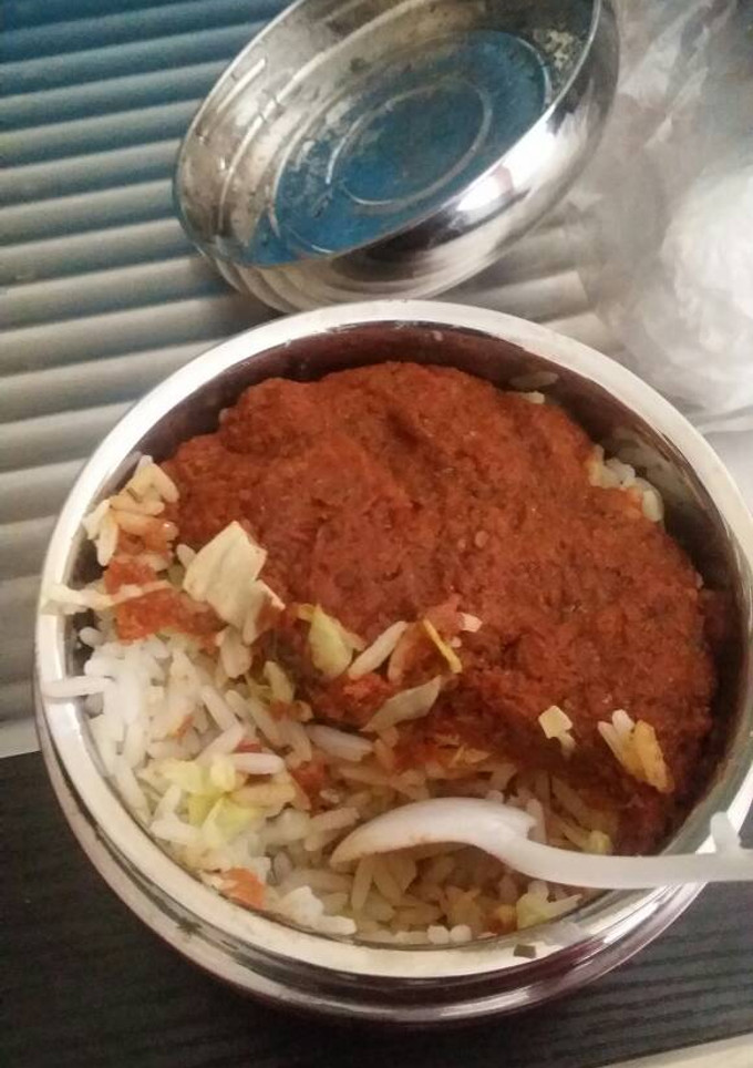 A picture of Rice and stew with cabbage.