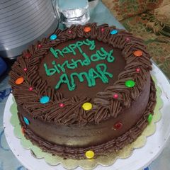 A picture of Chocolate cake wit orange chocolate buttercream.