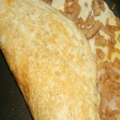 A picture of Stuffed omelette with Chicken salami.