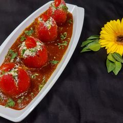 A picture of Stuffed Tomato Curry.
