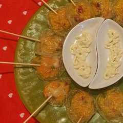 Una foto de Piruletas de paella