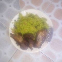 A picture of Fried Rice and chicken.