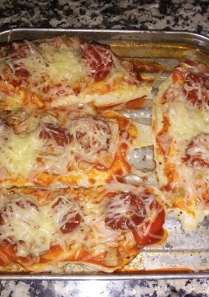 Una foto de Pechugas de pollo estilo pizza