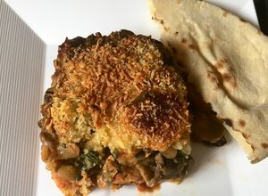 Una foto de Lasaña de Maduro y champiñones