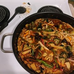 A picture of Spicy squid and mushroom udon.