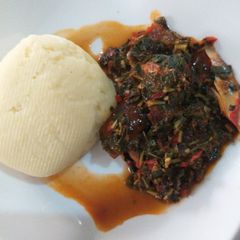 A picture of Poundo potato swallow with vegetable soup.