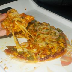 A picture of Domino style pizza without oven and without yeast.