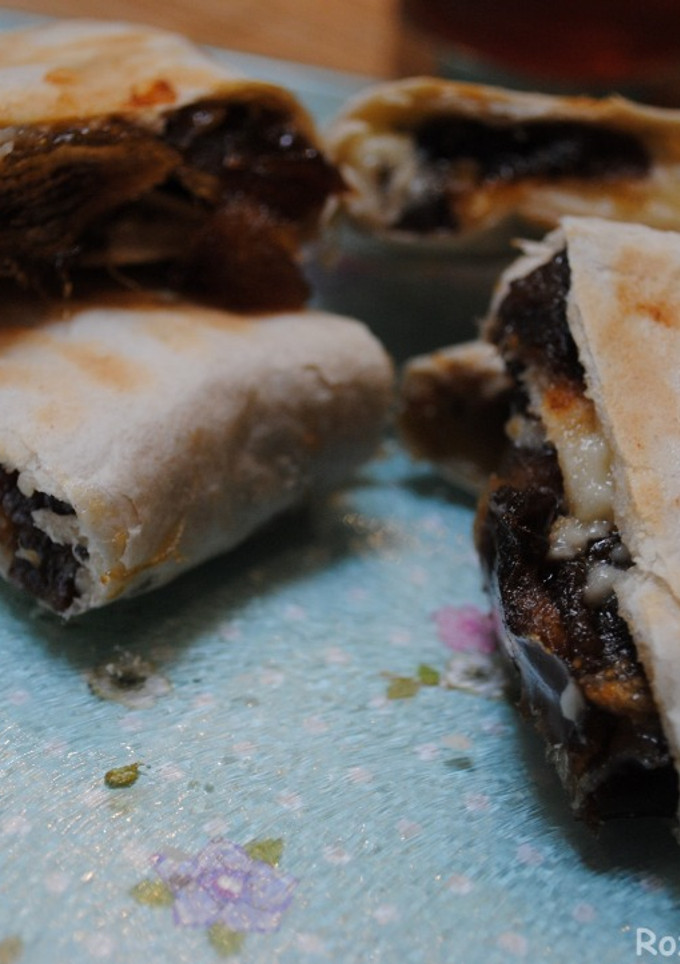 A picture of Mashed dates and cheddar cheese wrapped in bread.