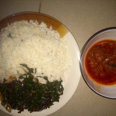 A picture of Rice and Stew with vegetable.