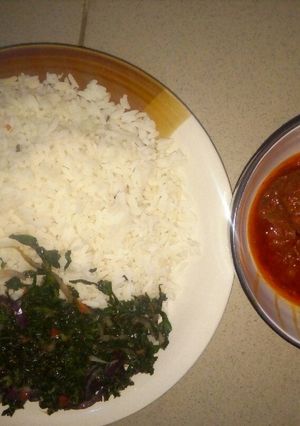A picture of Rice and Stew with vegetable.