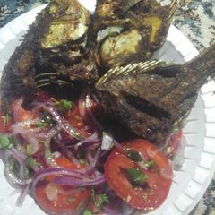 A picture of Fried fish with kachumbari #localfoodcontest_mombasa.