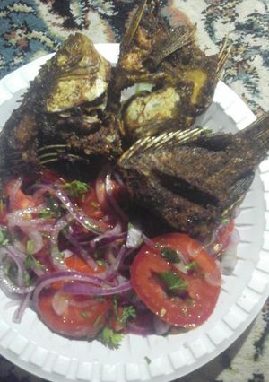 A picture of Fried fish with kachumbari #localfoodcontest_mombasa.
