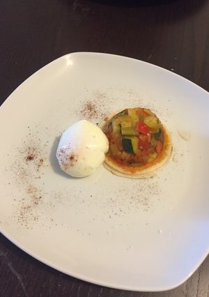 A picture of Poached Eggs with Pisto.