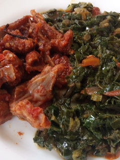 A picture of Wet fried goat meatwith spinach.