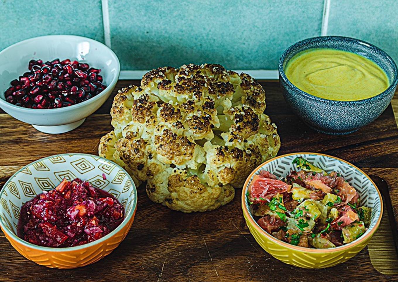 Whole roasted cauliflower with her bodyguards