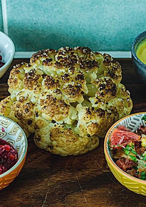 A picture of Whole roasted cauliflower with her bodyguards.