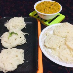 A picture of Idiyappam With Tomato kurma.