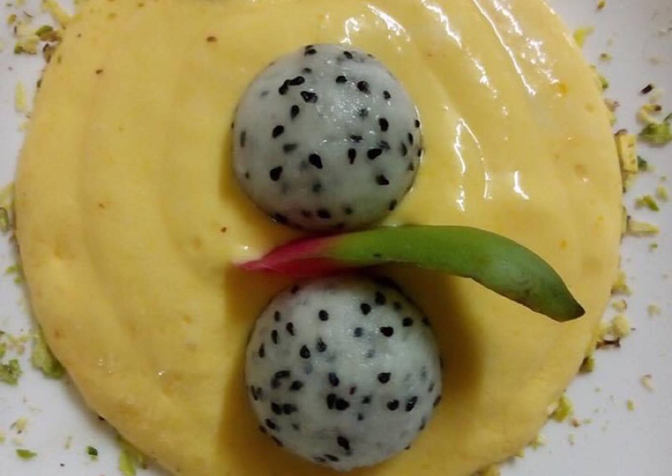 Mango cream serve with dragon fruit