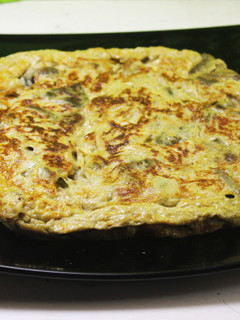 Una foto de Tortilla cuadrada de alcachofas con leche